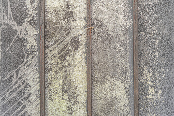 abstract background of an old ruberoid fence with metal frame