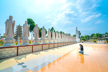Vung Tau, Vietnam - February 24th, 2021: Architecture presbytery temple Dai Tong Lam moring sunshine, which attracts tourists to visit spiritually and pray Buddha in Vung Tau, Vietnam
