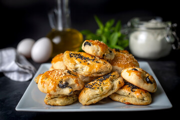 Turkish style pastry with olives and dill cheese pastry (Turkish name; Zeytinli pogaca ve dere otlu peynirli pogaca)