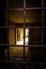 Obraz na płótnie Canvas old abandoned building dark room with yellow sun light
