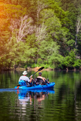 Fototapeta na wymiar Two unidentifiable people in a canoe kayak