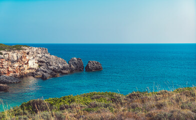 Fototapeta na wymiar mediterranean rocky coast with blue sky and sea