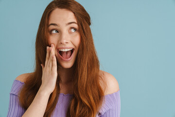 Young ginger excited woman expressing surprise on camera
