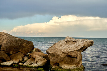 View of the sea bay shore with large rocks