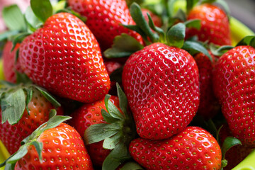 Set of red strawberries on the board, large ripe strawberries, rhythm close up