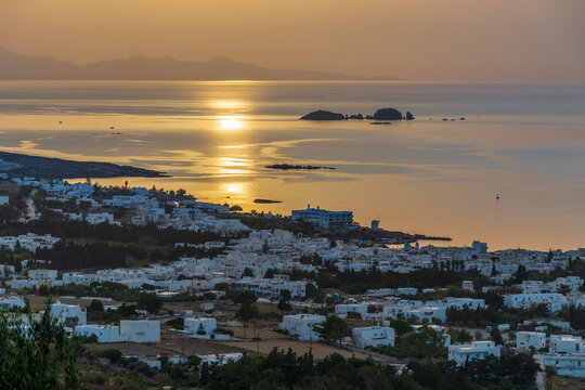 Golden hour panorama view   of the   of parikia village with the traditional white houses in Paros island, Greece.