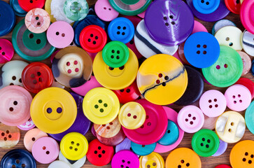 Fototapeta na wymiar Sewing buttons background. Colorful sewing buttons texture