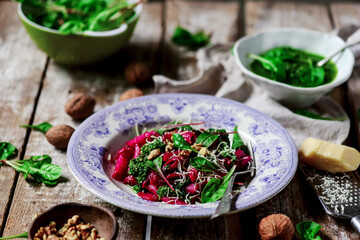 Beet pasta with spinach pesto .style rustic