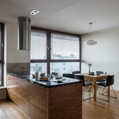 Stylish kitchen with dining table and big window