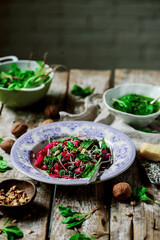 Beet pasta with spinach pesto .style rustic