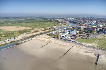 Fototapeta na wymiar Littlehampton Seafront and River Arun with Golf Course in the background at this popular tourist destination in Southern England. Aerial Photo.