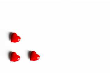 Three red hearts on the corner isolated on white background. Valentines day and love concept with copy space.