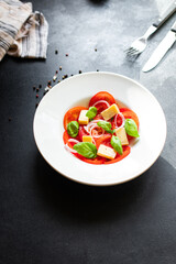 tomato salad veggie vegetable basil diet on the table summer healthy food diet meal snack copy space food background rustic. top view vegan or vegetarian food