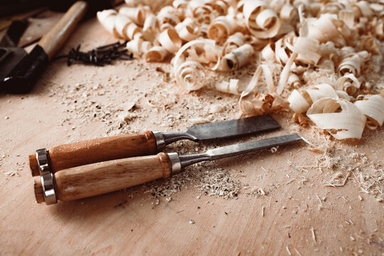Carpenter's chisel, woodwork tool on the desktop in the workshop