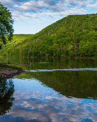 A valley with the Allegheny river flowing through it in Althom, Pennsylvania, USA with the border of the Allegheny National Forest at the far treeline