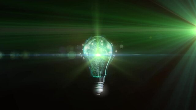 Animation of lit light bulb with green glowing light and copy space
