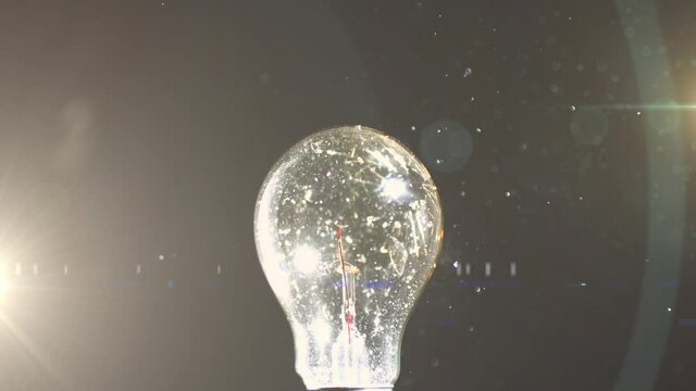 Animation of light bulb glowing networks hit by ball and copy space