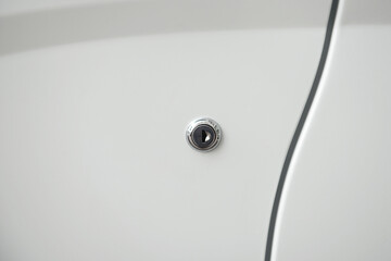 Lock fixing a car door on a white background of the body. - 436860187