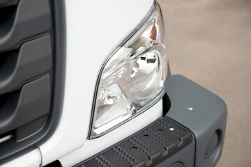 Clean headlight and plastic car bumper. - 436860377