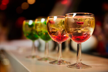 Multicolored alcoholic and non-alcoholic cocktails with ice