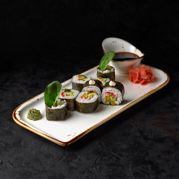 Sushi roll maki futo japanese food on a black stone plate. Sushi menu. Japanese food.