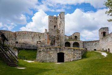 Fototapeta na wymiar Stone gothic ruins of old medieval castle Rabi in National Park Sumava, ancient fortress in sunny spring day, landmark in countryside, stronghold on the hill, Rabi, Czech Republic