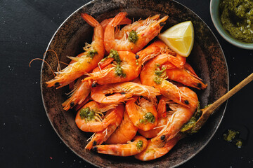 Shrimps with spices on pan