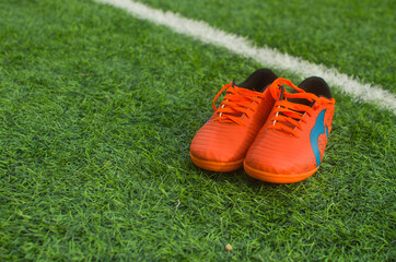 Pair Of Soccer Shoes On grass field