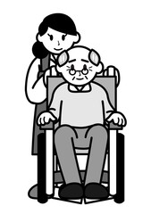 車いすの老人と若い女性介護士