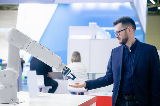 Concept communication engineer man and robot hand with handshake industrial 4 - Powered by Adobe