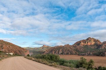 Road, farm and mountain landscape at Red Stone Hills