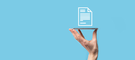 Male hand holding a document icon on blue background. Document Management Data System Business Internet Technology Concept. Corporate data management system DMS