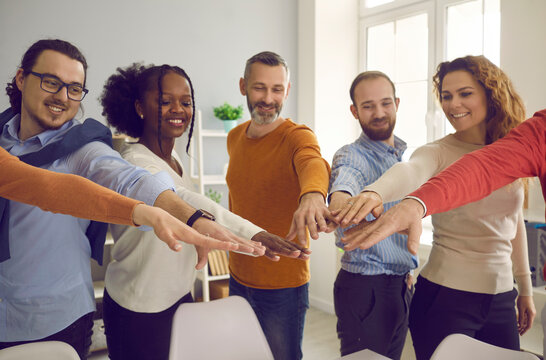 Large Group Of Happy Diverse People Different Age Gathering Together Spreading Hands Joining Palms In Circle. Social Support, Helping Hands, Volunteer Connect, Corporate Coaching Training Concept