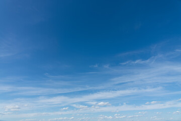 Blue sky with light clouds background, natural sunny day sky replacement - obrazy, fototapety, plakaty
