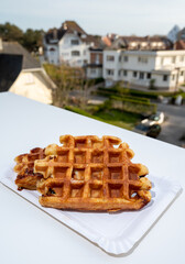 Belgian sugar waffles with black coffee served outdoor