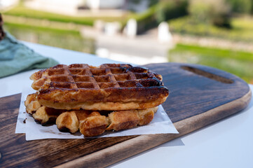 Belgian sugar waffles served on outdoor cafe terrace