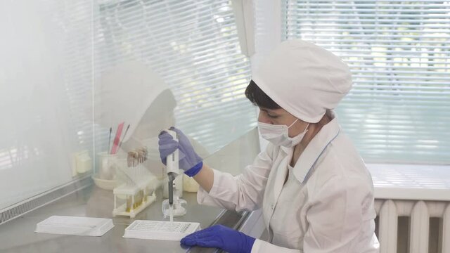 Female woman ecologist scientist biologist researcher with test tube liquid. Biological research genetic engineering laboratory, food farming, poultry production