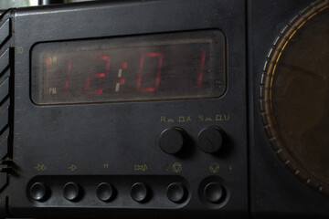 Old clock radio showing 12:01 