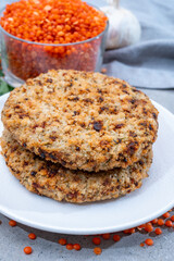 Healthy vegetarian or vegan food, meat free burger made from orange lentils legumes