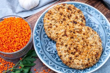 Healthy vegetarian or vegan food, meat free burger made from orange lentils legumes