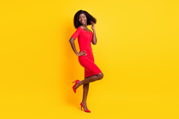 Fototapeta na wymiar Full length body size view of attractive thin cheerful girl dancing having fun isolated over bright yellow color background