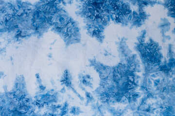 The fabric indigo tie dye as a background and texture.