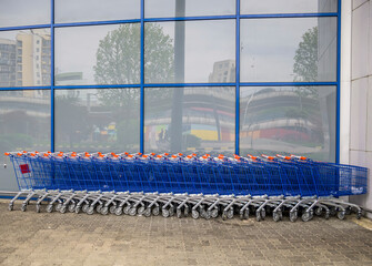 Many aligned shopping carts at the hypermarket