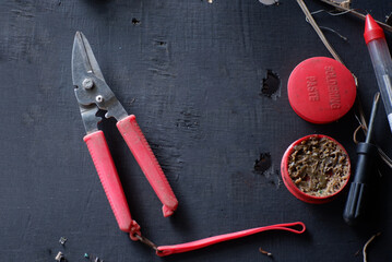 Soldering iron   solder on  deep bokeh background