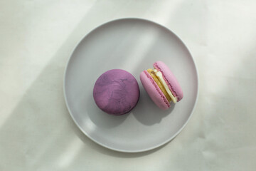 Sweet colorful macarons isolated on white background.