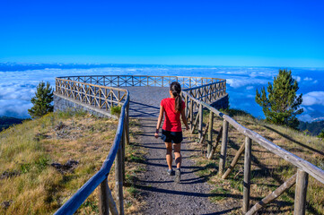 Hiker in Madeira Island - View Point of mountain scenery of the highland - tabove the clouds -...