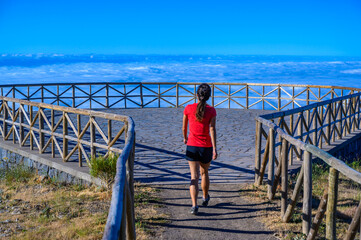 Hiker in Madeira Island - View Point of mountain scenery of the highland - tabove the clouds -...