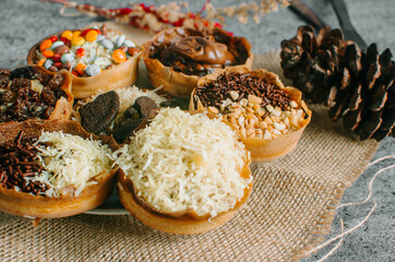 Martabak Manis is Indonesia dessert. Sweet Martabak with chocolate, cheese, peanut. this picture in white background and blurry, selective object.