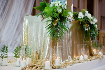 Wedding table with tropical golden decorations