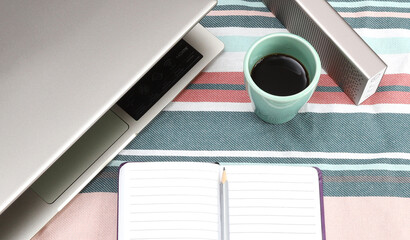 Modern home office or work place with laptop, notebook and coffee, Top view with copy space, flat lay